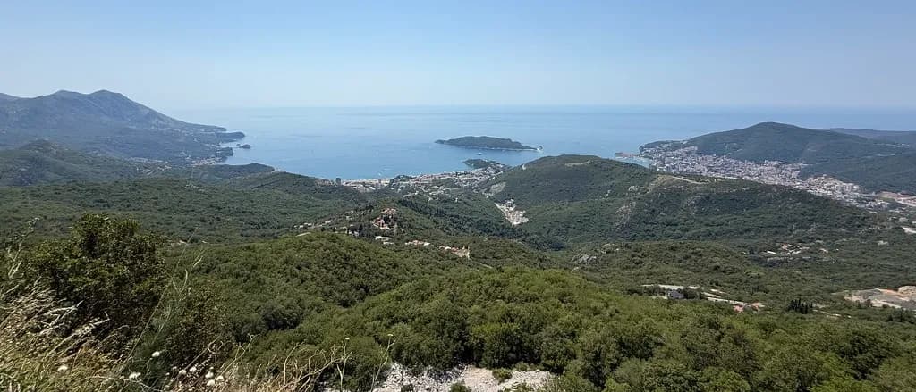 The Budva Riviera in Montenegro seen from the hills above the coast — the stretch of coastline the Mediteran Express local bus runs along.